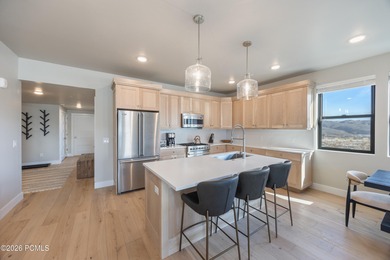 Experience elevated mountain living in this 2025 three-bedroom