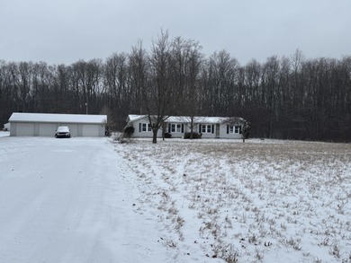 This lovely modular home on 3 acres of private land is a nice