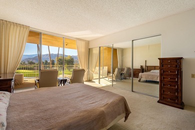 Perched above the shimmering lake and emerald fairways, 899