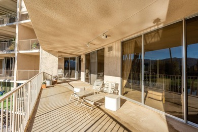 Perched above the shimmering lake and emerald fairways, 899