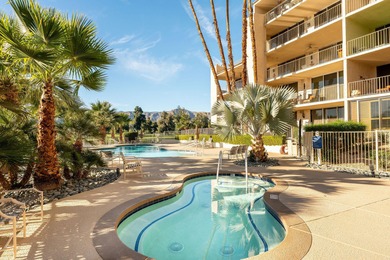 Perched above the shimmering lake and emerald fairways, 899