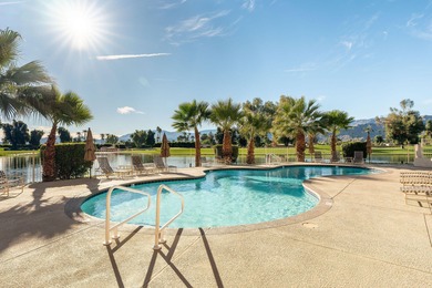 Perched above the shimmering lake and emerald fairways, 899