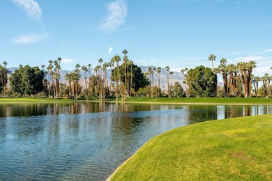 Perched above the shimmering lake and emerald fairways, 899