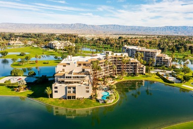 Perched above the shimmering lake and emerald fairways, 899