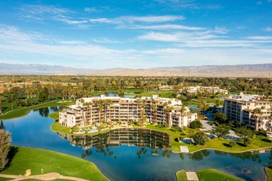 Perched above the shimmering lake and emerald fairways, 899