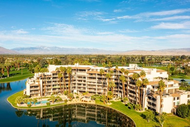 Perched above the shimmering lake and emerald fairways, 899