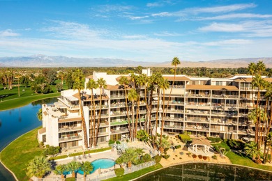 Perched above the shimmering lake and emerald fairways, 899