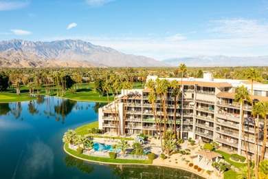 Perched above the shimmering lake and emerald fairways, 899