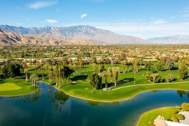 Perched above the shimmering lake and emerald fairways, 899