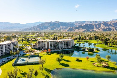 Perched above the shimmering lake and emerald fairways, 899