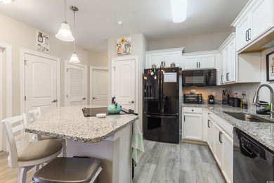 Welcome to Queens Harbour! This move-in ready 2-bedroom, 2-bath