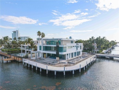 Set on a coveted point lot in the exclusive Harbor Beach enclave