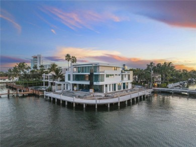 Set on a coveted point lot in the exclusive Harbor Beach enclave