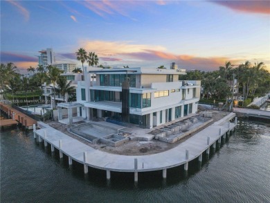 Set on a coveted point lot in the exclusive Harbor Beach enclave