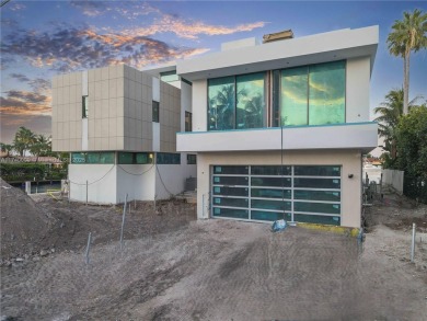 Set on a coveted point lot in the exclusive Harbor Beach enclave