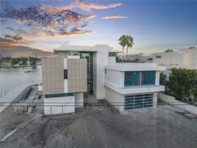 Set on a coveted point lot in the exclusive Harbor Beach enclave