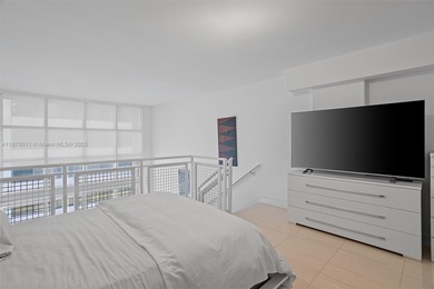 Stylish and spacious bi-level loft-style condo in the exclusive