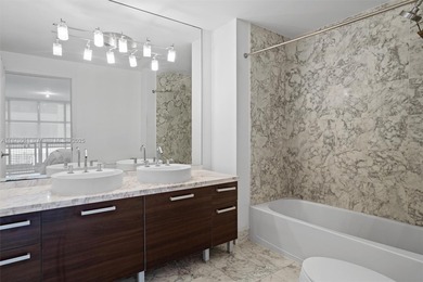 Stylish and spacious bi-level loft-style condo in the exclusive