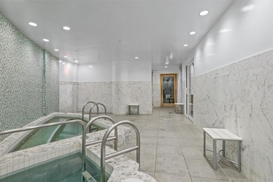 Stylish and spacious bi-level loft-style condo in the exclusive