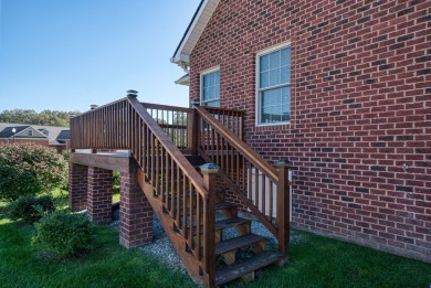 Embrace maintenance-free living in this beautiful end-unit