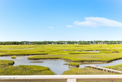 Enjoy coastal living at its finest on Figure Eight, an exclusive