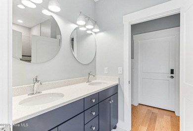 Enjoy coastal living at its finest on Figure Eight, an exclusive