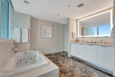 Step into this elegant two-bedroom, two-and-a-half-bathroom