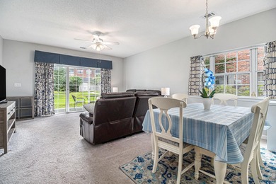 Enjoy effortless coastal living in this first floor, end-unit