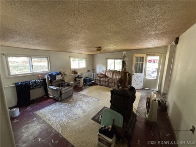 Start your Lake of the Ozarks adventure with this 1960 home full