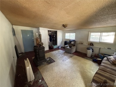 Start your Lake of the Ozarks adventure with this 1960 home full