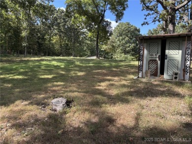 Start your Lake of the Ozarks adventure with this 1960 home full