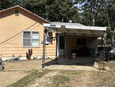 Start your Lake of the Ozarks adventure with this 1960 home full