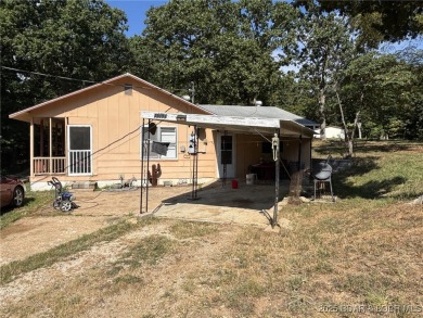 Start your Lake of the Ozarks adventure with this 1960 home full