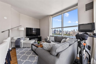 **Breathtaking East River Views from Luxury Astoria High-Rise**

