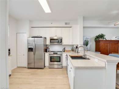 FULL GOLF MEMBERSHIP INCLUDED with this pristine 2/2 1st floor