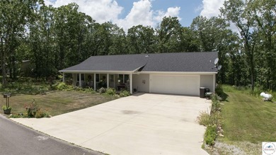 ABSOLUTELY STUNNING lake home right off of Hwy UU and just 3.4