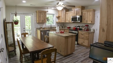 ABSOLUTELY STUNNING lake home right off of Hwy UU and just 3.4