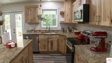 ABSOLUTELY STUNNING lake home right off of Hwy UU and just 3.4