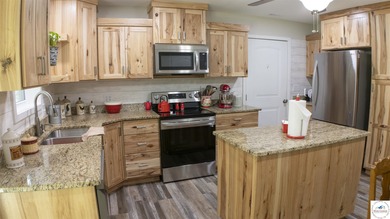 ABSOLUTELY STUNNING lake home right off of Hwy UU and just 3.4