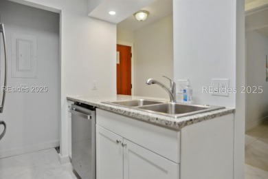 Nicely remodeled first floor villa with pool view, granite