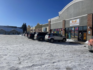 Modern strip mall with 6 tenants plus 1 vacancy. Prime location