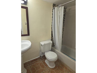 Experience the best of lakefront living in this bright and airy