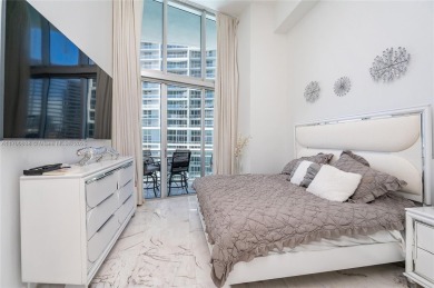 An exquisite 2-bed 2-bath + den residence with breathtaking 16ft