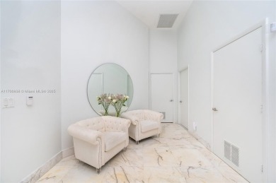 An exquisite 2-bed 2-bath + den residence with breathtaking 16ft