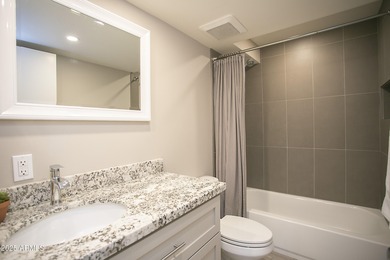 Outstanding open-concept contemporary remodel! Kitchen is chefs