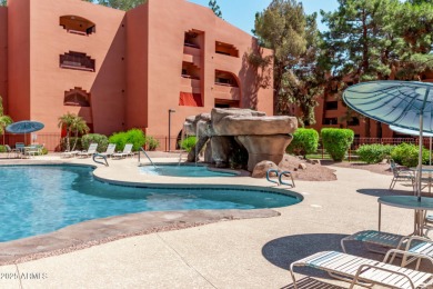 This highly desired ground level home provides great views and