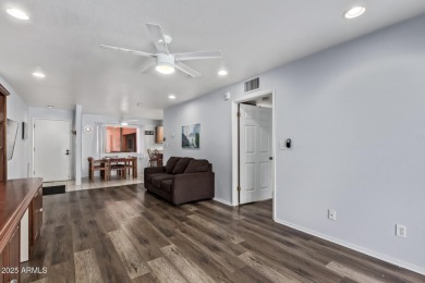 This highly desired ground level home provides great views and