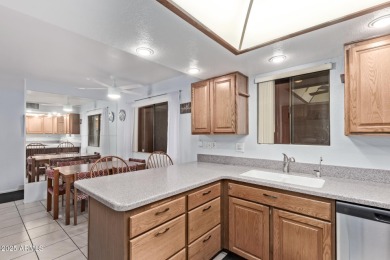 This highly desired ground level home provides great views and