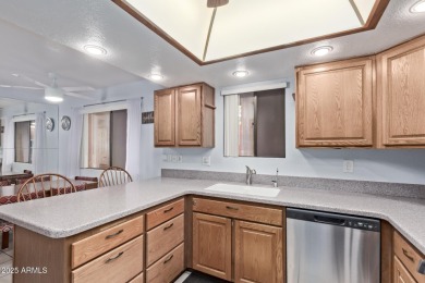 This highly desired ground level home provides great views and