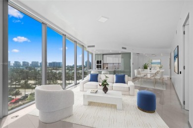 Sleek oceanfront corner residence offering 2 bedrooms + den, 2.5